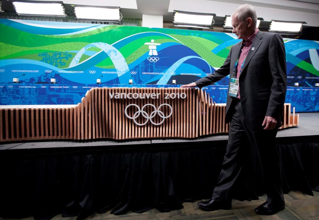 VANOC Chief Executive Officer John Furlong checks out the victory ceremony podium for the Vancouver 2010 Winter Olympic Games during an unveiling news conference in Vancouver on February 2, 2010.