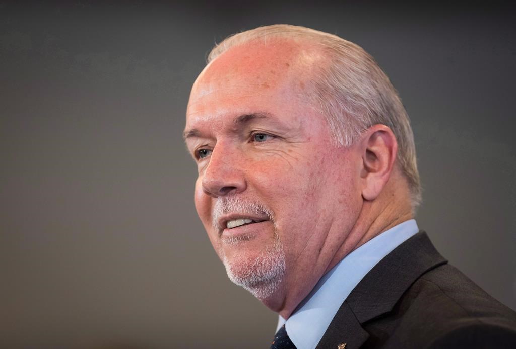 FILE - B.C. Premier John Horgan speaks during an LNG Canada news conference in Vancouver on October 2, 2018.