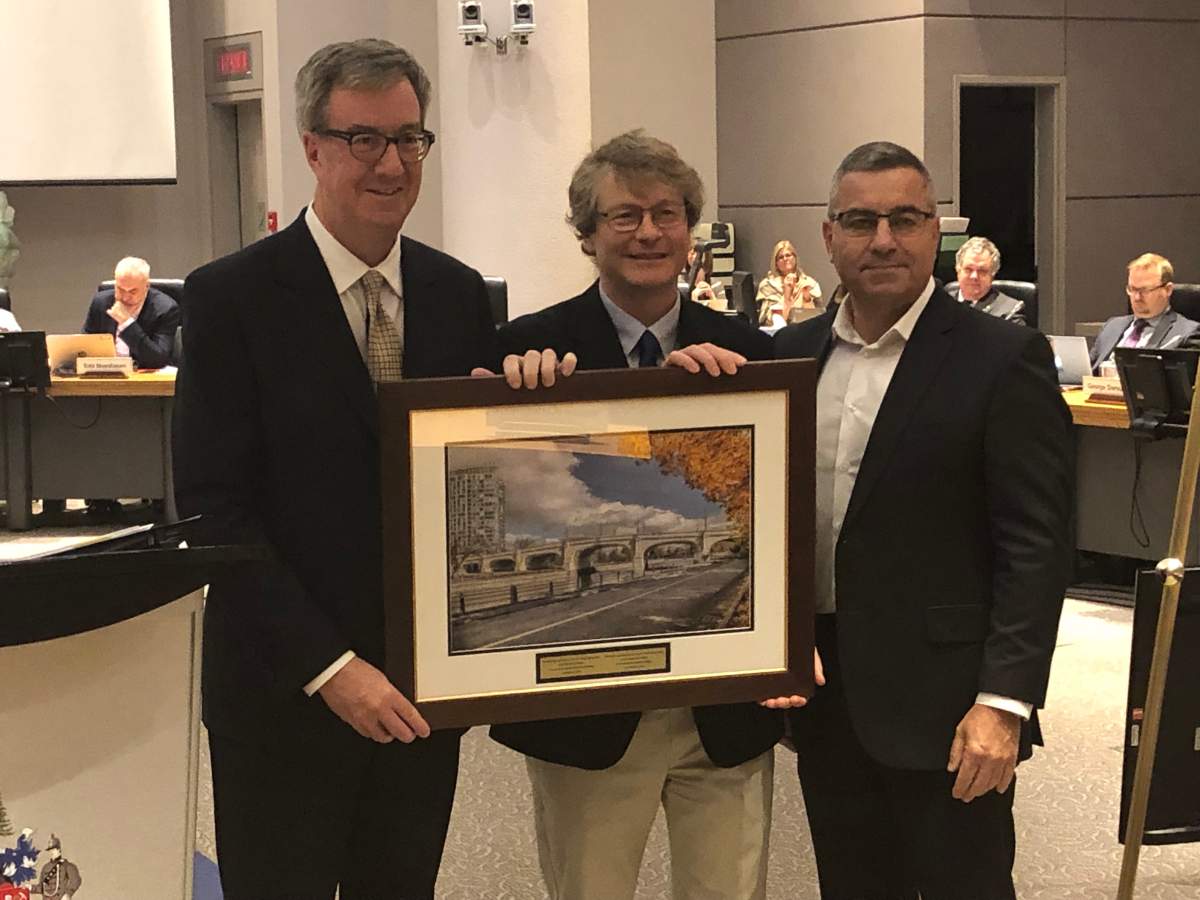 David Chernushenko (centre) was the city councillor for Capital Ward for eight years. Ottawa Mayor Jim Watson (left) and city manager Steve Kanellakos (right) recognized Chernushenko, who was not re-elected in October, for his public service during the final city council meeting of the term on Nov. 28, 2018.