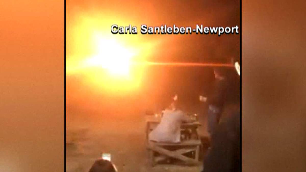 An explosion of fire lights up the night sky on Saturday, Nov. 10, 2018, in Texas after explosives tied to a wedding dress were set off.