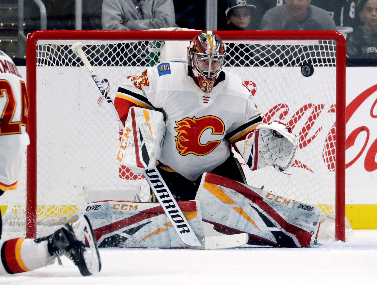 Calgary Flames goaltender David Rittich blocks a shot during the third period of an NHL hockey game against the Los Angeles Kings in Los Angeles, Saturday, Nov. 10, 2018. The Flames won 1-0.