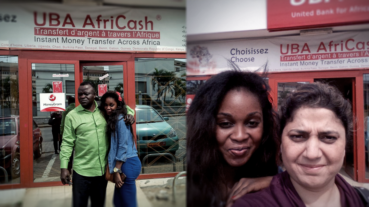 Sunanda Kikla (right) standing outside a bank. Cameroon, December 2013.