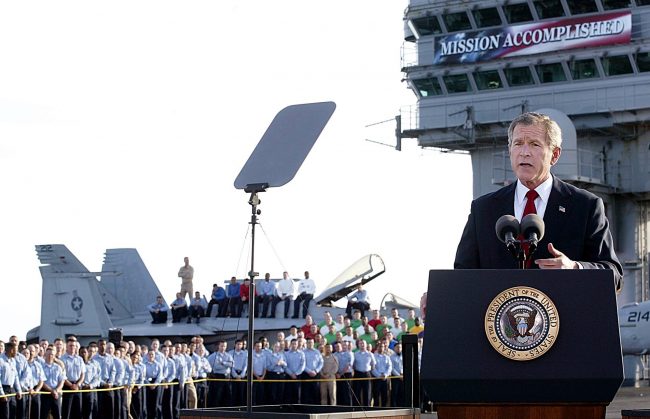 US President George W. Bush addresses the nation aboard the nuclear aircraft carrier USS Abraham Lincoln as it sails for Naval Air Station North Island, San Diego, Cali., May 1, 2003. “In the Battle of Iraq, the United States and our allies have prevailed,” Bush said.