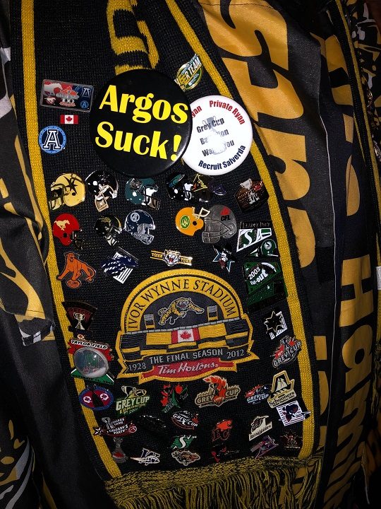 CFL pins attached to a drover coat.