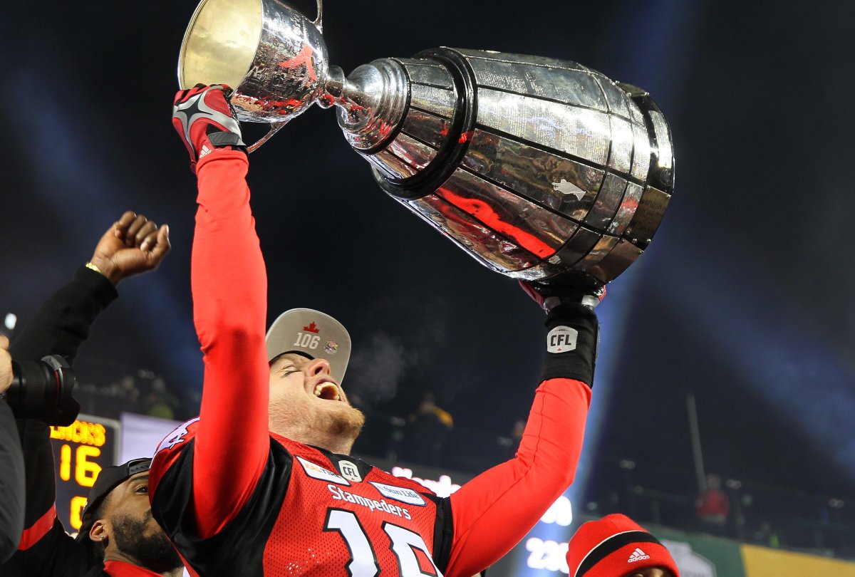Stampeders' Bo Levi Mitchell hoists the Grey Cup after CFL Grey Cup championship game, in Edmonton on Sunday, November 25th, 2018.