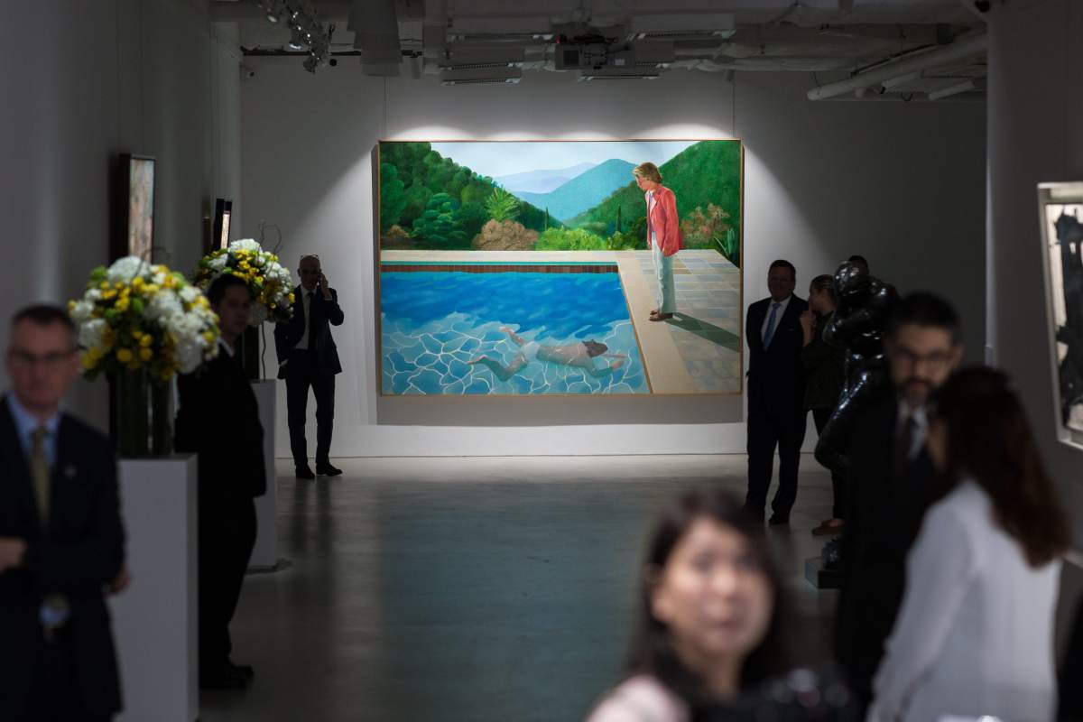 English artist David Hockney’s “Portrait of an Artist (Pool with Two Figures)” is displayed during a Christie’s auction preview in Hong Kong, China, 27 September 2018.