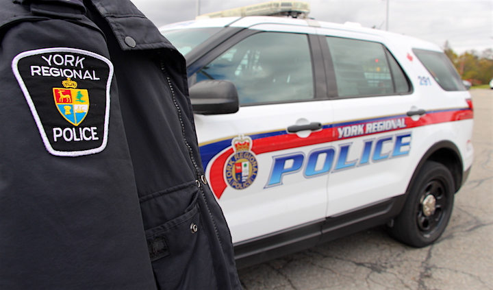 An officer and a York Regional Police cruiser at the service's Richmond Hill station.