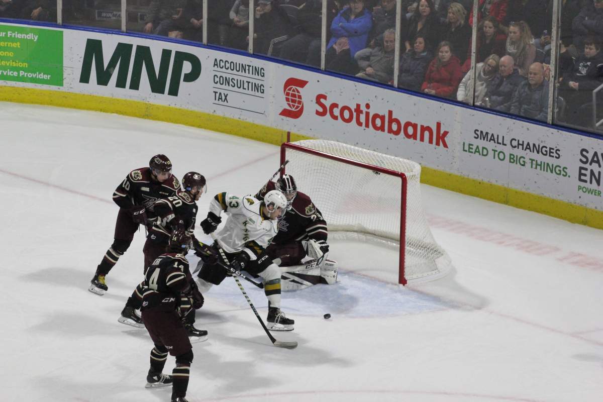 Paul Cotter takes the puck to the net in his London Knights’ debut.