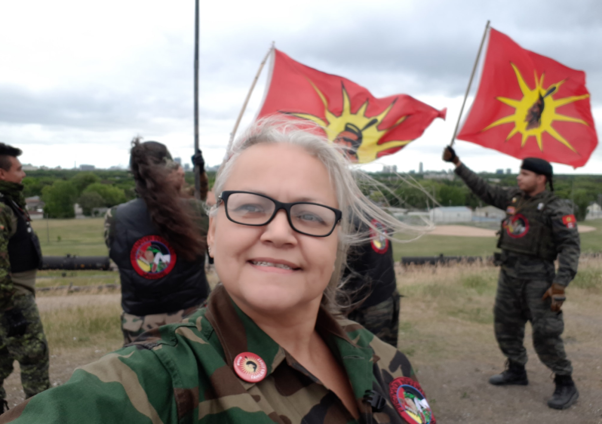 Lisa poses with some of the Indigenous Warriors group.