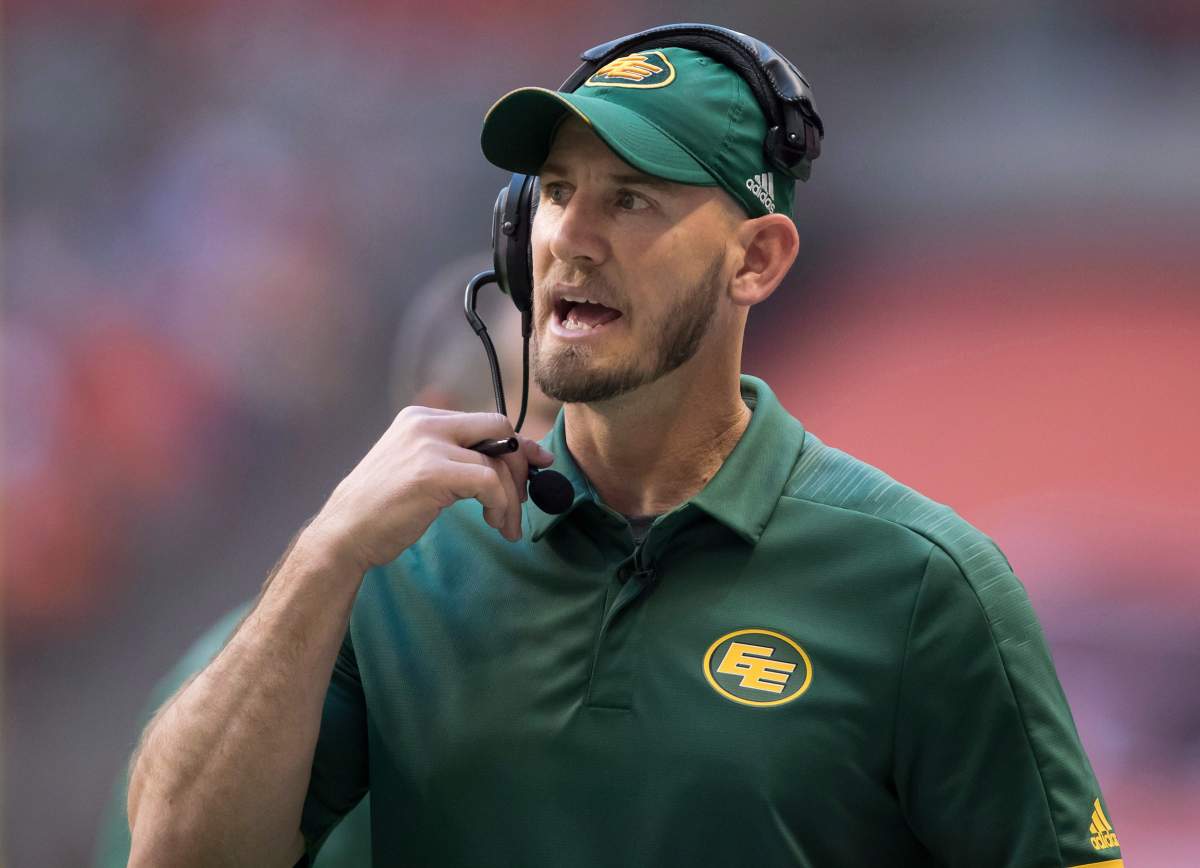 Edmonton Eskimos head coach Jason Maas stands on the sideline during first half CFL football action against the B.C. Lions, in Vancouver on Thursday, August 9, 2018.