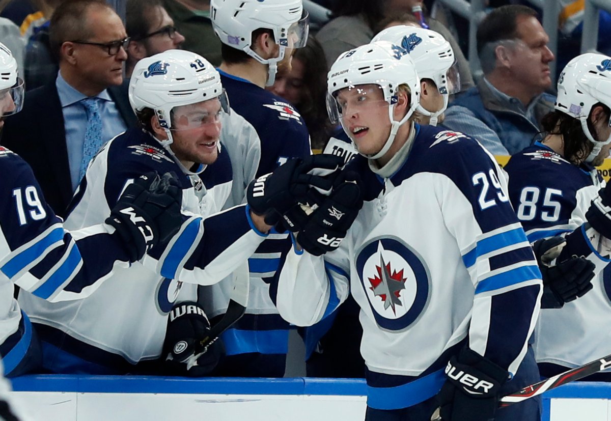 Winnipeg Jets' Patrik Laine (29), of Finland, is congratulated by Brendan Lemieux after scoring during the second period of an NHL hockey game against the St. Louis Blues, Saturday, Nov. 24, 2018, in St. Louis. (AP Photo/Jeff Roberson).