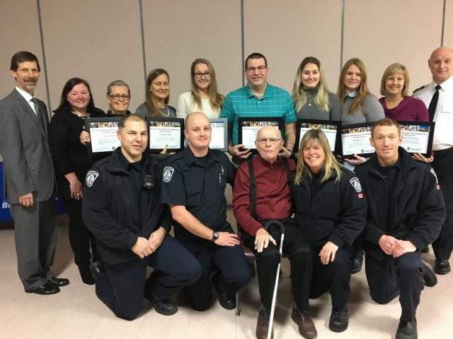 Mr. Breedveld is surrounded by the lifeguards and first responders who saved his life on September 24, 2019.