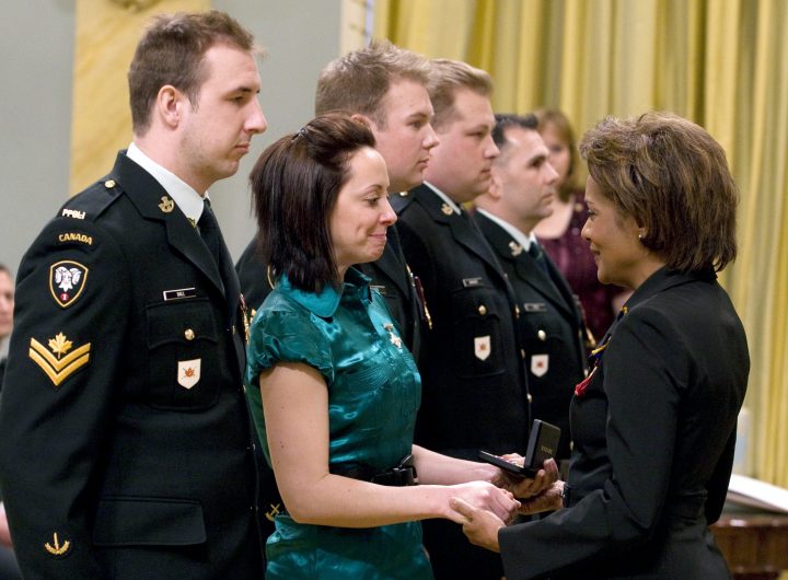 Governor General Michaelle Jean speaks with Megan Leigh Stewart as she presents her with the Star of Military Valour to her presented posthumously to her common-law husband, Capt. Jonathan Snyder, during a ceremony at Rideau Hall Friday, Feb. 13, 2009.