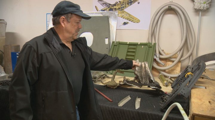 Bradshaw holding some of the original wreckage.