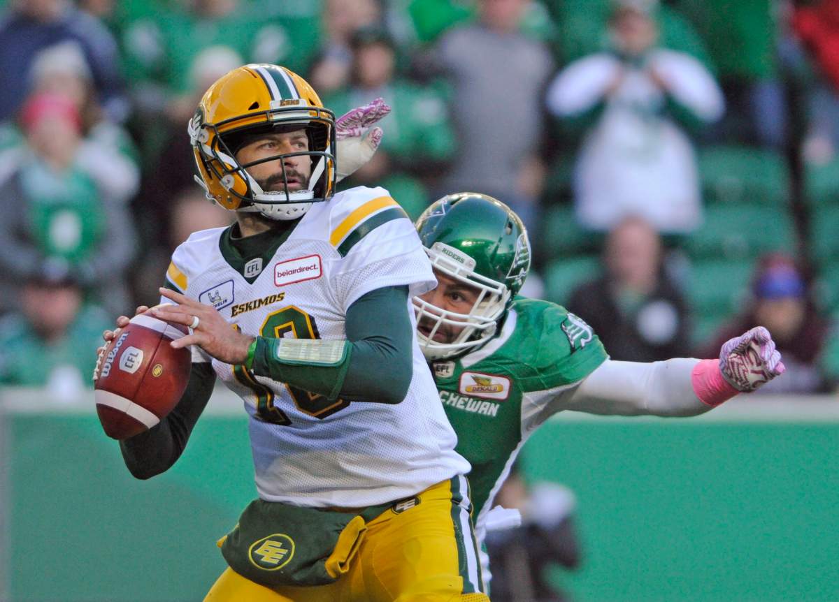 Saskatchewan Roughriders linebacker Cameron Judge gains on Edmonton Eskimos quarterback Mike Reilly before stripping the ball during second half CFL action in Regina on Monday, Oct. 8, 2018.