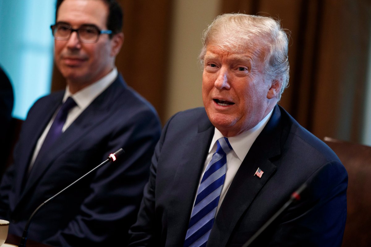 Treasury Secretary Steve Mnuchin, left, listens as President Donald Trump speaks during an expanded bilateral meeting with the Emir of Kuwait Sheikh Sabah Al Ahmad Al Sabah in the Cabinet Room of the White House, Wednesday, Sept. 5, 2018, in Washington. 