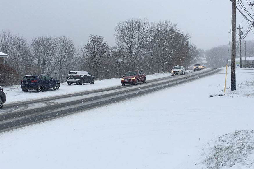 Motorists trek through the snow in Fredericton on Tuesday, Nov. 13, 2018. 