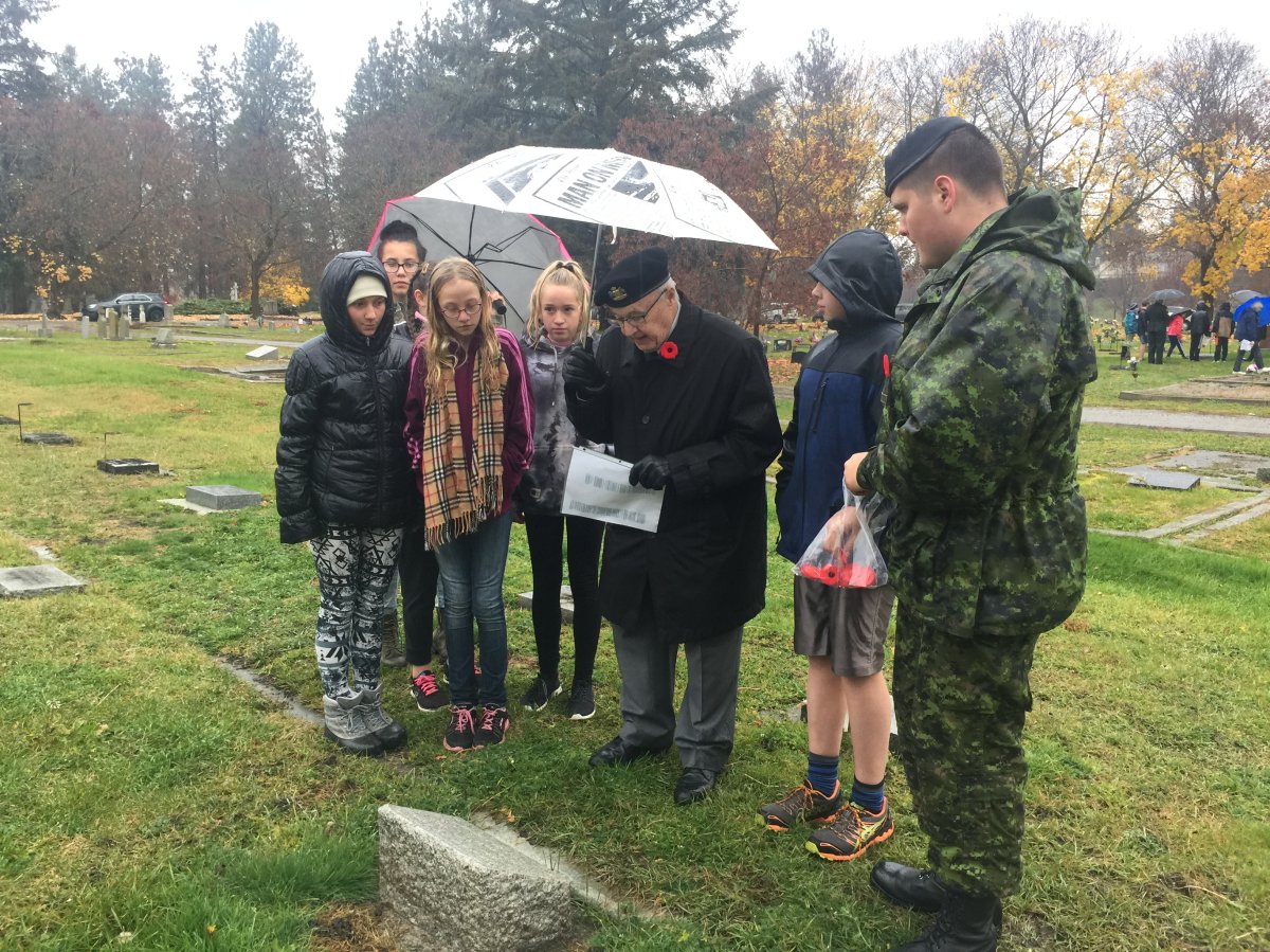 Poppies are laid on veteran  headstones at Pleasant Valley Cemetery in Vernon Thursday morning. 