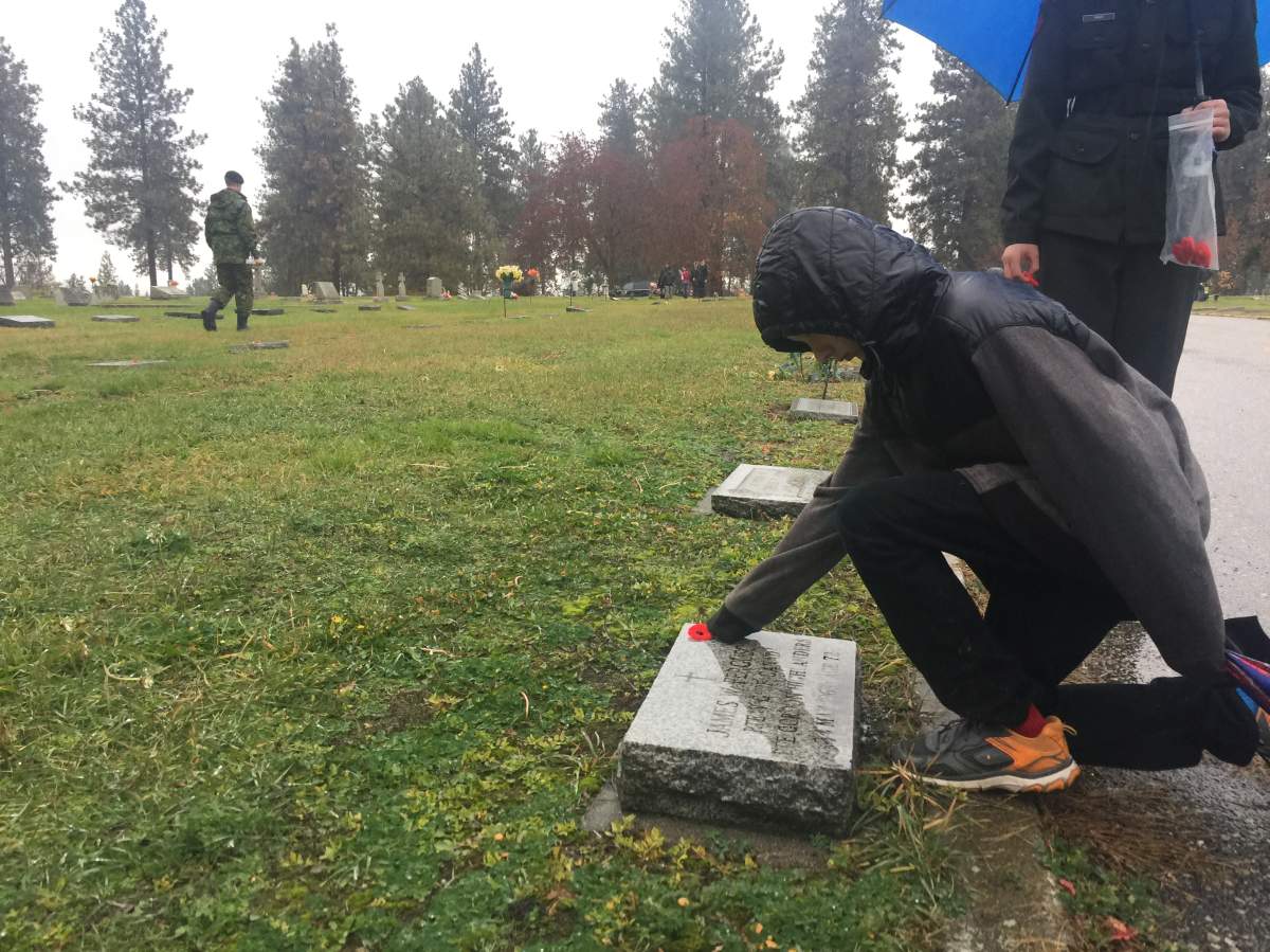 Students along with the B.C. Dragoons placed on poppies on more than 500 veteran headstones at Pleasant Valley Cemetery in Vernon.