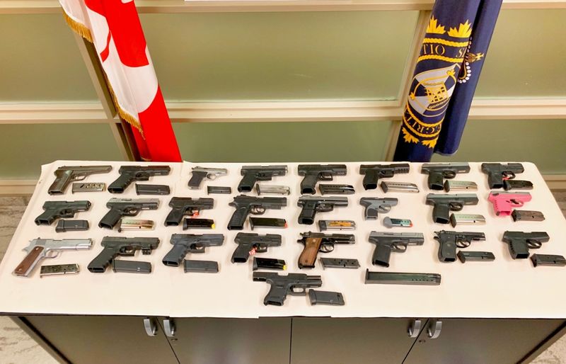 Police display firearms seized during a police investigation called Project Belair.