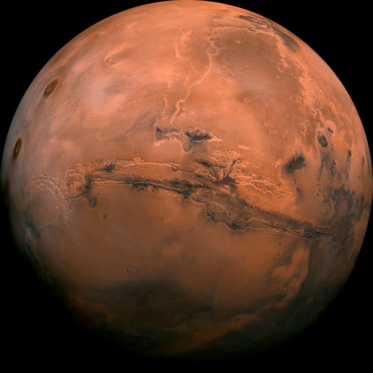 FILE - This image made available by NASA shows the planet Mars. This composite photo was created from over 100 images of Mars taken by Viking Orbiters in the 1970s. In our solar system family, Mars is Earth‚Äôs next-of-kin, the next-door relative that has captivated humans for millennia. The attraction is sure to grow on Monday, Nov. 26 with the arrival of a NASA lander named InSight. (NASA via AP, File).