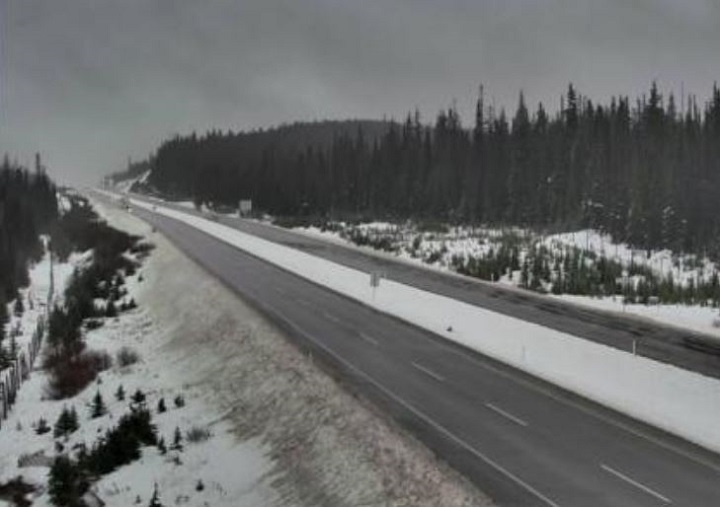 Driving conditions at the Pennask Summit on the Okanagan Connector show wet, but snow-free lanes.