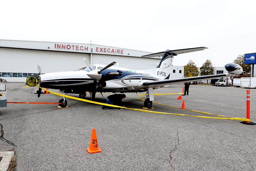 An investigator with the Transportation Safety Board of Canada examines a Piper PA-42 involved in a mid-air collision in west Ottawa on Sunday morning. This photo was taken sometime after the aircraft landed at the Ottawa International Airport.