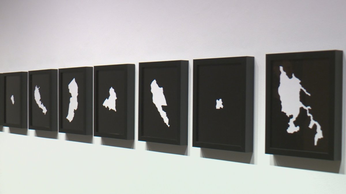 Artwork from 'Refugio' exhibit lines the walls of the U of L art gallery.