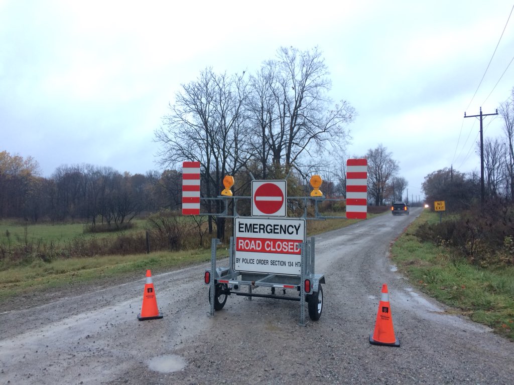 An emergency road closure sign blocks traffic heading north on Bodkin Road, which divides Middlesex Centre from Oneida Nation.