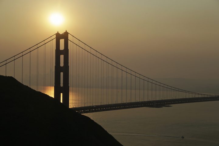 Smoke from wildfires obscures the San Francisco skyline behind the Golden Gate Bridge Friday, Nov. 9, 2018, near Sausalito, Calif.