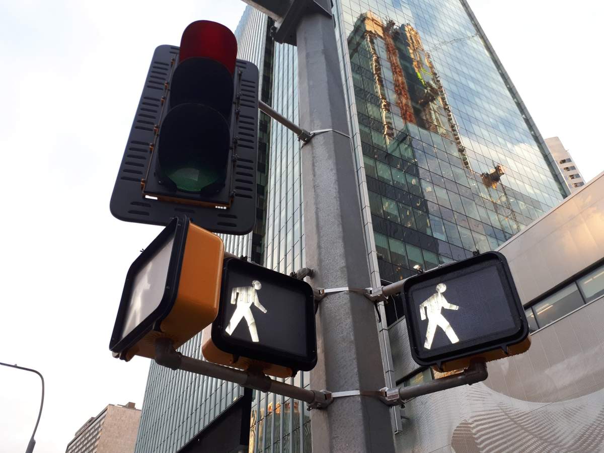 The lights of a pedestrian scramble crosswalk near Rogers Place in downtown Edmonton. 