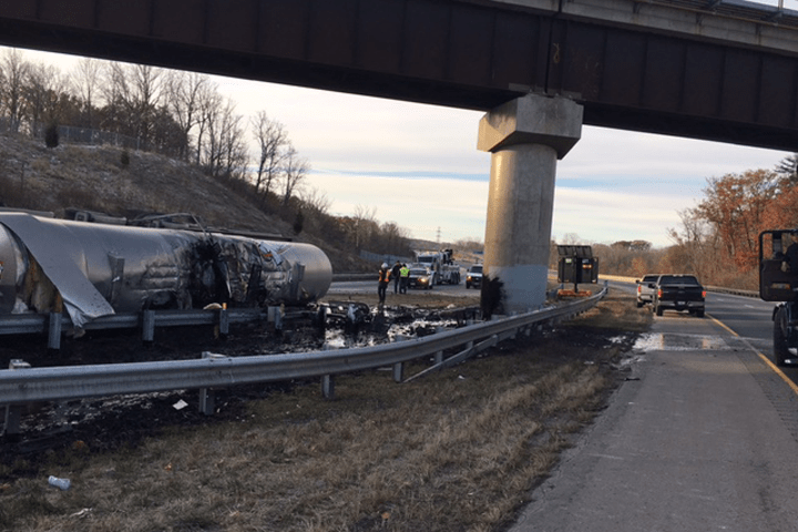The city of Hamilton says a tractor-trailer  spilled approximately 44,000 litres of liquid asphalt onto the road and into the grassy median area.