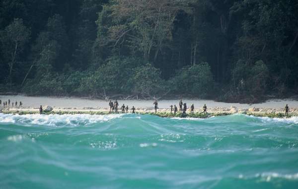 Tribespeople seen on the shores of a North Sentinel island beach in an undated photo.