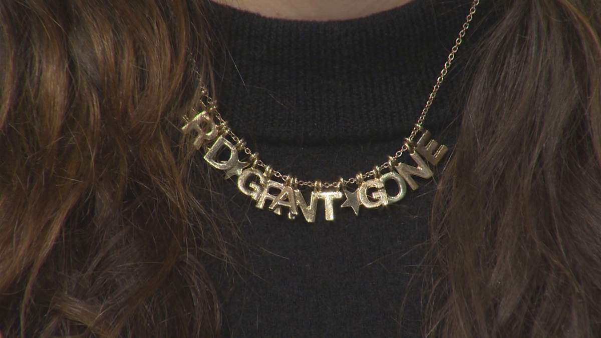 A necklace worn by Hajjar saying “Brad + Grant gone”, referring to Stella’s regional manager Brad Burrows and Stella’s CEO Grant Anderson.