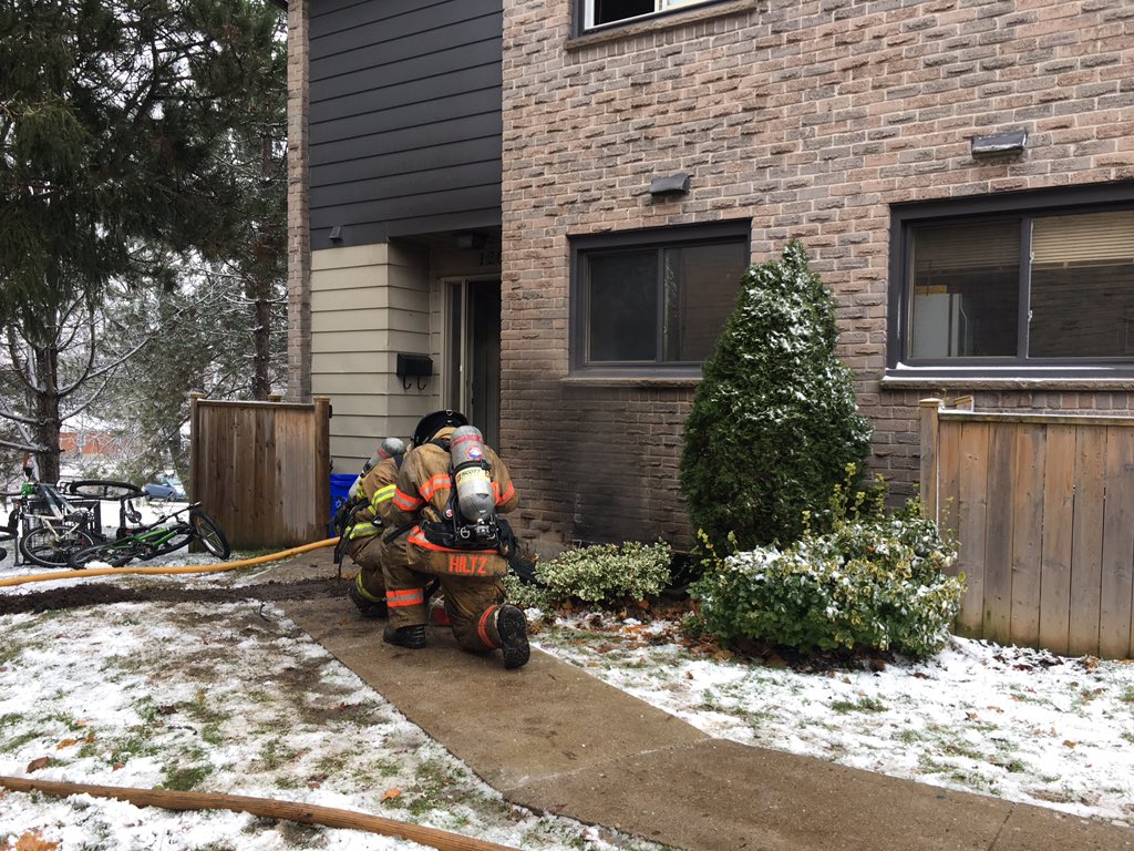 Fire crews continue dousing hot spots following a blaze inside a townhouse unit on Summit Avenue in London on Tuesday, Nov. 27, 2018. 