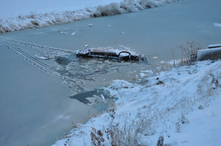RCMP is looking for a man after a truck was found partially submerged in a creek in Swift Current.