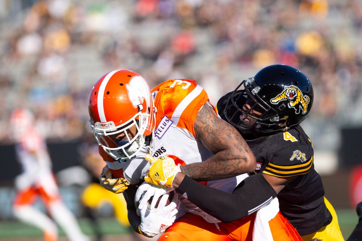 BC Lions wide receiver RickyCollins Jr. (3) is tackled by Hamilton Tiger-Cats defensive back Richard Leonard (4) during first half CFL Football game action in Hamilton, Ont. on Saturday, September 29, 2018. 