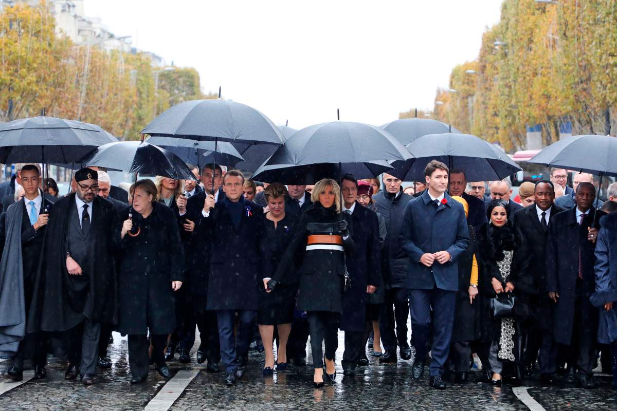 (From L) Morocco’s Prince Moulay Hassan, Moroccan King Mohammed VI, German Chancellor Angela Merkel, French President Emmanuel Macron and his wife Brigitte Macron, Canadian Prime Minister Justin Trudeau, Niger’s President’s wife Lalla Malika Issoufou, Niger’s President Mahamadou Issoufou and Republic of Guinea’s President Alpha Conde walk towards the Arc de Triomphe, in Paris, France, as part of the commemorations marking the 100th anniversary of the 11 November 1918 armistice, ending World War I, Sunday, Nov. 11, 2018.