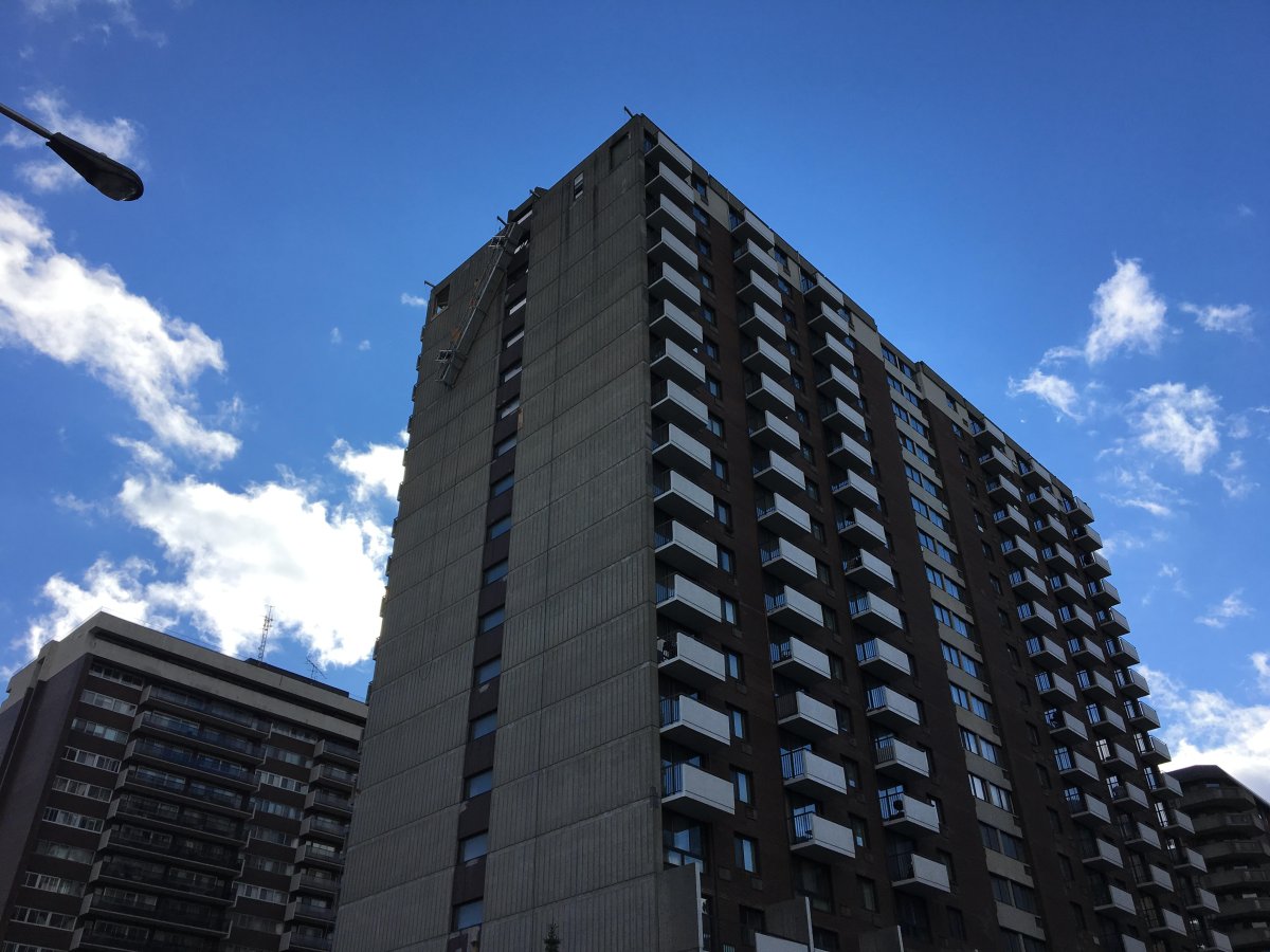Firefighters rescued two men dangling from harnesses near the  17th floor of this Cote-Saint-Luc building on Nov. 8, 2018.