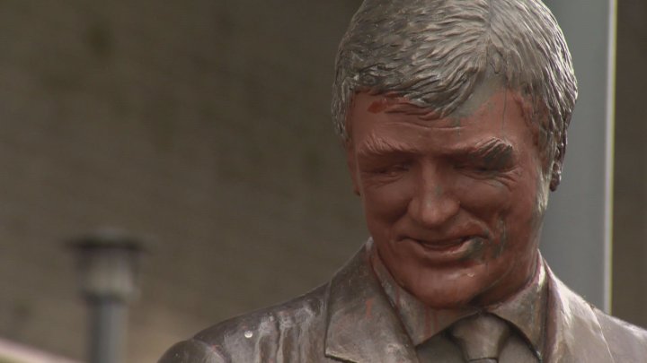 The face of the statue honouring Canucks coach Pat Quinn was covered in orange paint.
