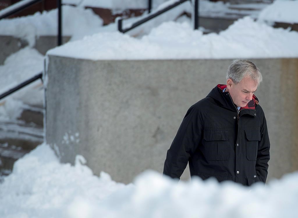 Dennis Oland heads to the Law Courts in Saint John, N.B., on Wednesday, Nov. 21, 2018. His trial in the bludgeoning death of his millionaire father, Richard Oland, will be by judge alone. The verdict from Oland’s 2015 murder trial was set aside on appeal in 2016 and a new trial ordered. Richard Oland, 69, was found dead in his Saint John office on July 7, 2011.
