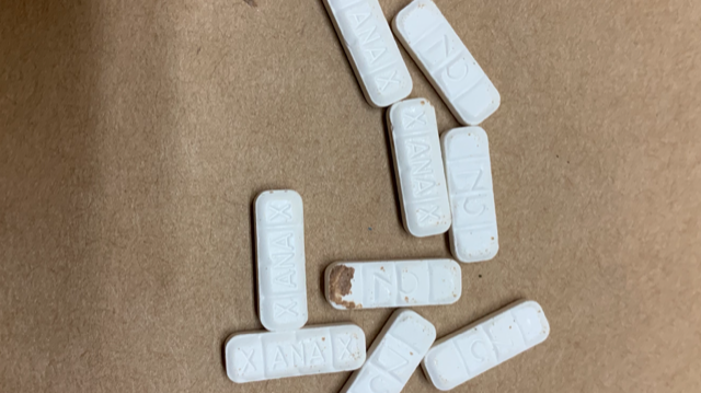 OPP released this image, with pills labelled "Xanax." Police say a 16-year-old was charged with drug trafficking after students were allegedly overdosing at a Napanee high school.