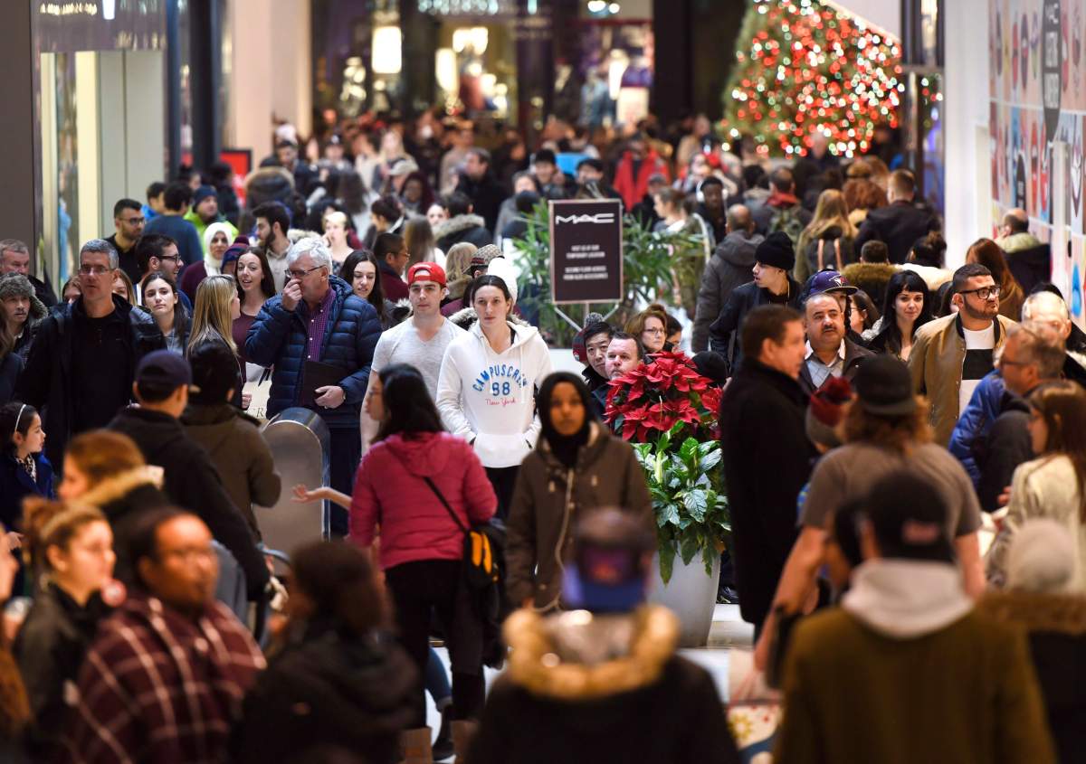 Shoppers walk through the Rideau Centre, in Ottawa on Boxing Day, Monday, Dec. 26, 2016.