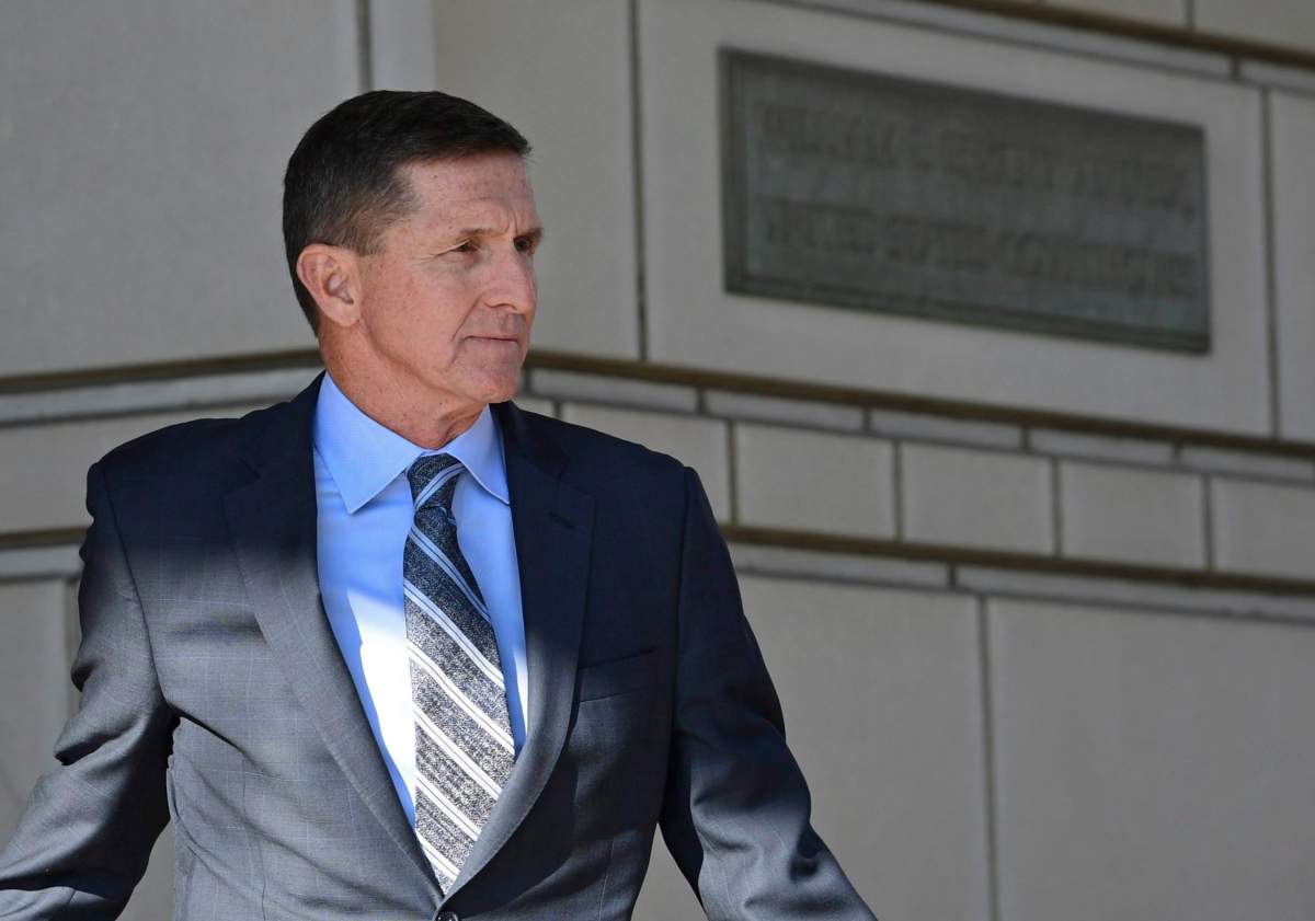 In this Dec. 1, 2017, file photo, former Trump national security adviser Michael Flynn leaves federal court in Washington.