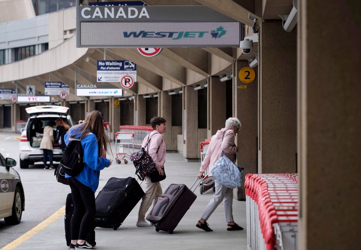 Travelers arrive at the Calgary Airport in Calgary, Alta., Thursday, May 10, 2018.