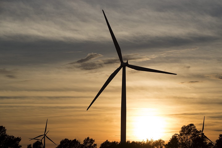 Wind turbines on Wolfe Island during sunset in Marysville, Ont. on Monday, Sept. 3, 2018. 