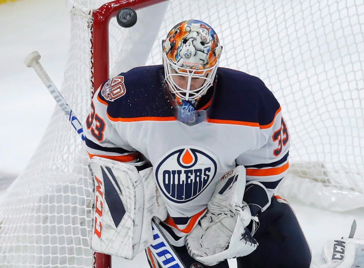 Edmonton Oilers' Cam Talbot makes a save against the Chicago Blackhawks during the third period of an NHL hockey game Sunday, Oct. 28, 2018, in Chicago. (AP Photo/Jim Young).
