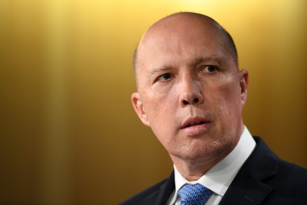 FILE - Australian Minister for Home Affairs Peter Dutton speaks to the media during a press conference with Australian Prime Minister Scott Morrison (not pictured) in Sydney, Australia, 22 November 2018.