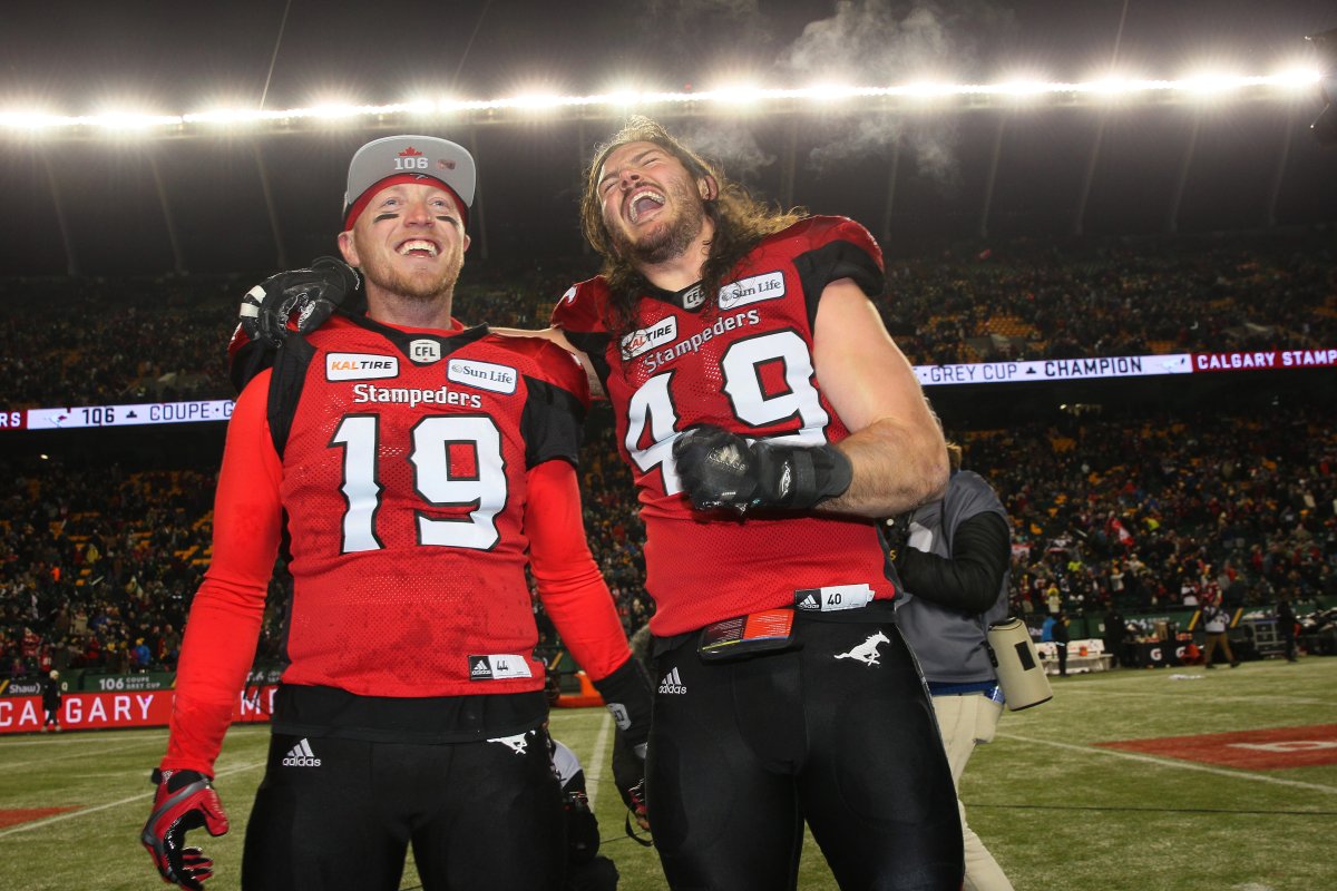 Stampeders' Bo Levi Mitchell celebrates with Alex Singleton after winning the CFL Grey Cup championship game, in Edmonton on Sunday, November 25th, 2018.