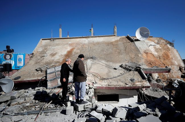 People look at the house of Palestinian family Abu Humaid after it was blown up by the Israeli forces in al-Amari refugee camp in Ramallah, in the Israeli-occupied West Bank December 15, 2018. 